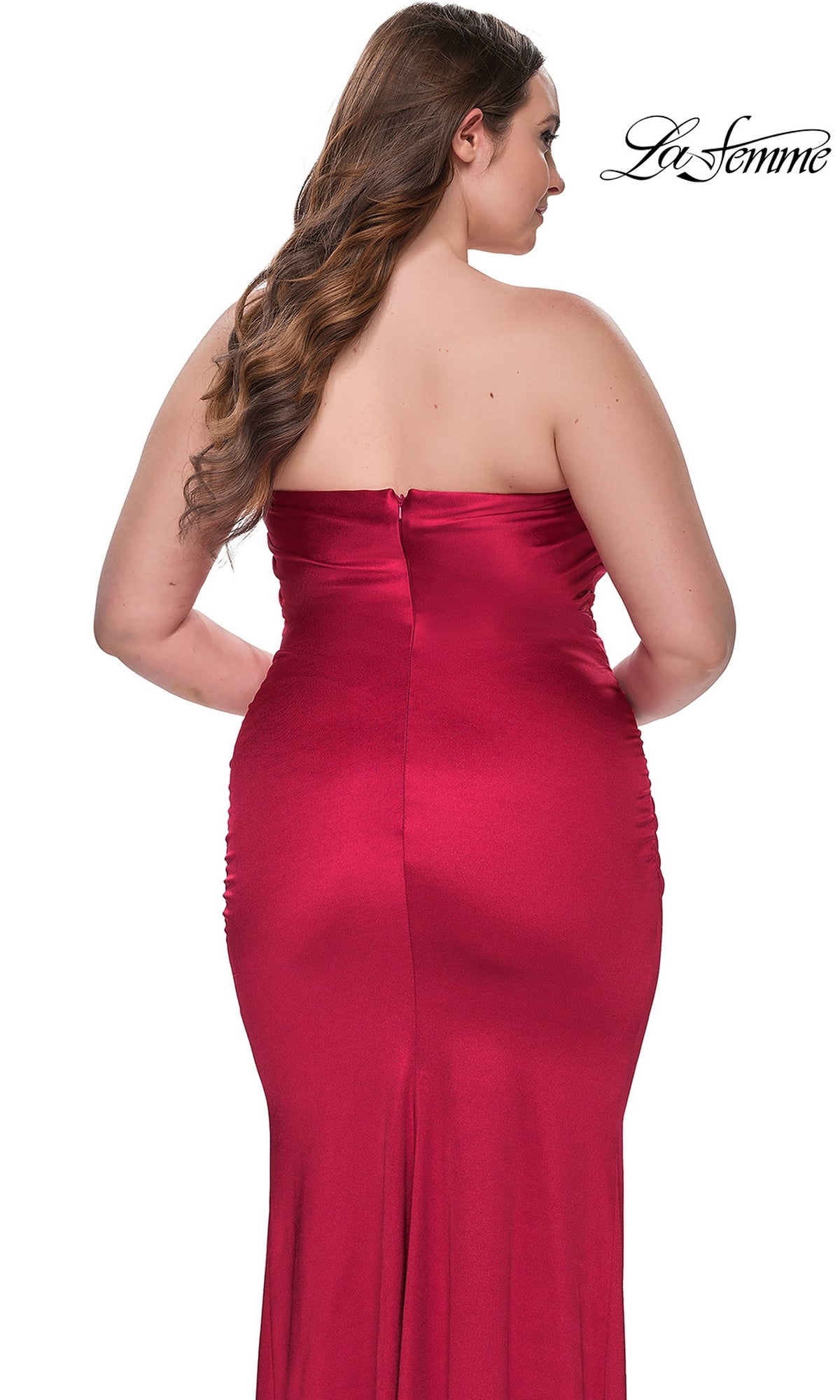 A woman models the La Femme Plus-Size Long Tube Prom Dress 32194 from the back against a white background, with the